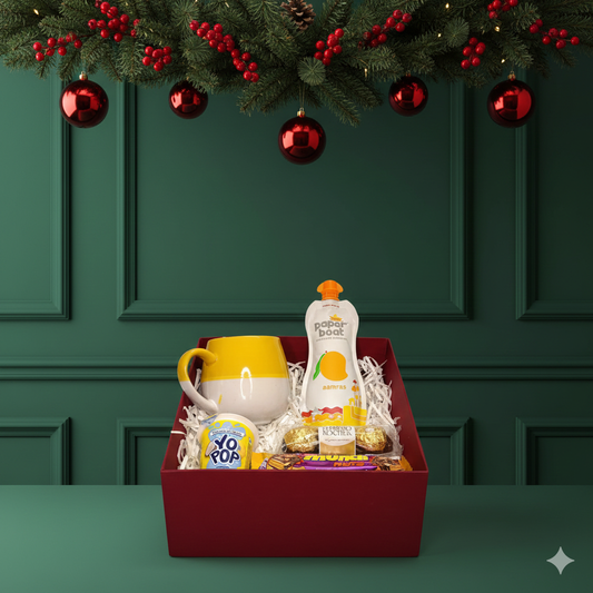 Merry Sips & Treats Christmas Hamper with ceramic mug, chocolates and festive snacks. A cheerful Secret Santa and office Christmas gifting option.