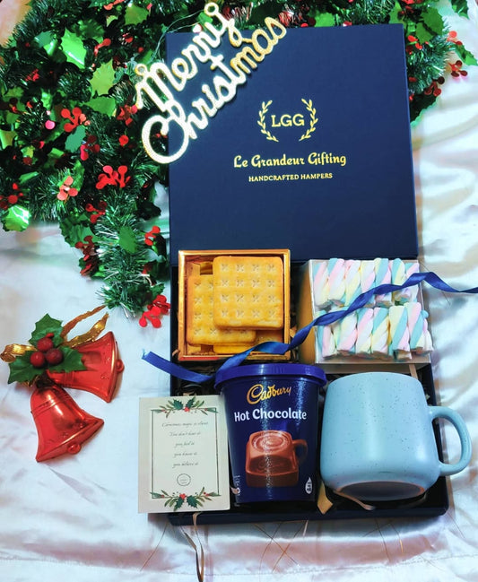 Warm Hugs Christmas Box with hot chocolate, marshmallows, biscuits and a ceramic mug. A cozy Christmas hamper for gifting, Secret Santa and corporates.