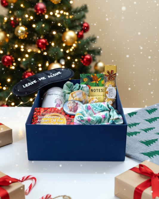 Cozy Christmas Comfort Box with self-care essentials, chocolates and cozy accessories. A perfect Christmas gift for her or Secret Santa hamper.
